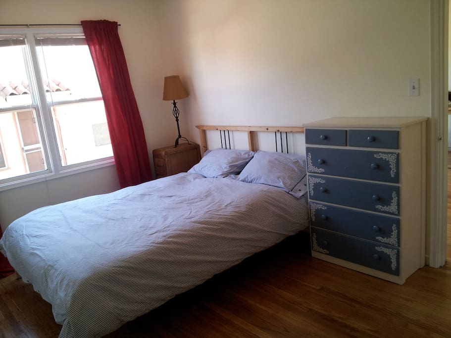 The bedroom has a comfortable queen-size bed