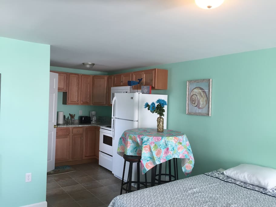 Full kitchen next to dining area