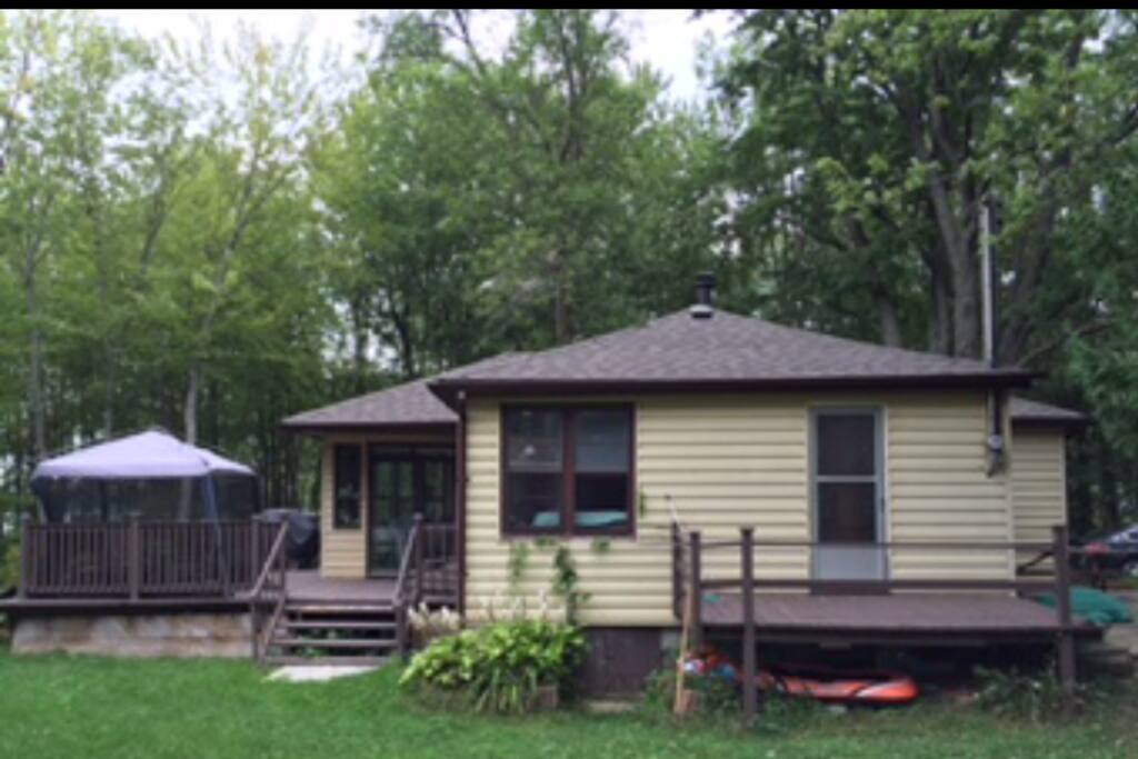 cottage, deck and kitchen tent.