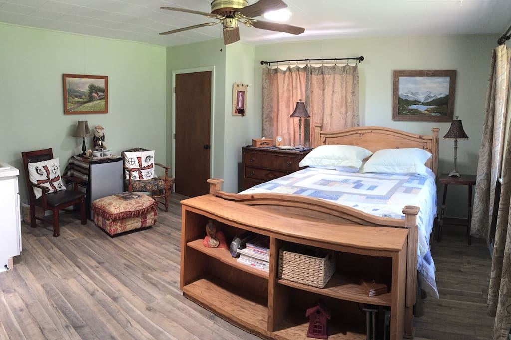Queen-size bed with fridge