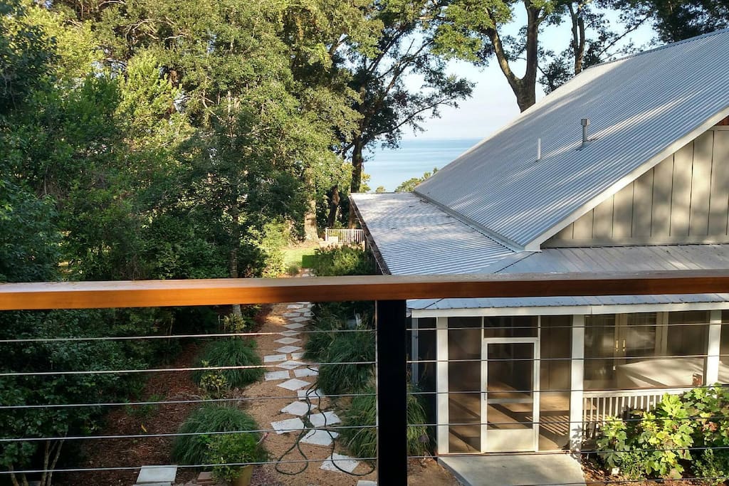 Guest house balcony view of Mobile Bay with main house on the right.