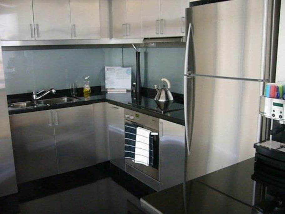 High tech kitchen, with oven, washer, dryer, fridge