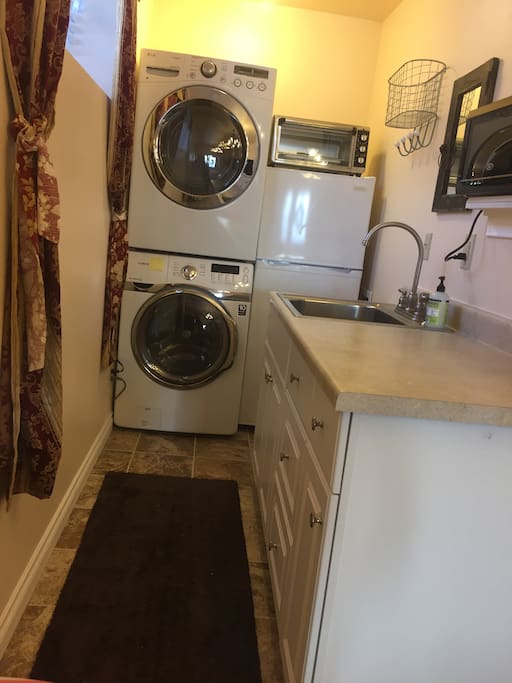 Kitchen includes fridge, microwave and hot plate. HE Washer and Dryer in unit.