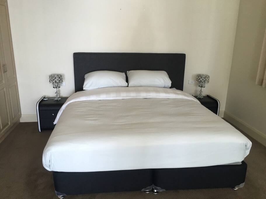Main bedroom with ensuite, balcony and harbour view