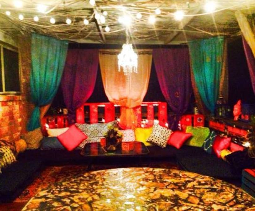 Patio has large table and chairs .Turkish style lounge area 2 fire pits and a barbecue pit . Garden and small pond .