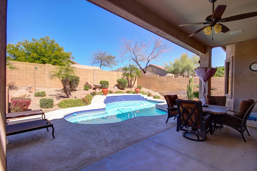 Gas barbecue grill, outdoor heater, patio dining.