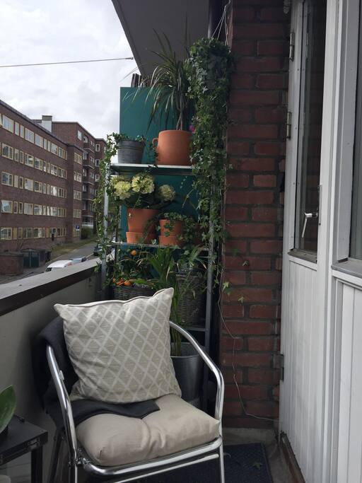 Small balcony with a "couch" and two chairs. Sun from 1 pm til 9/10 am