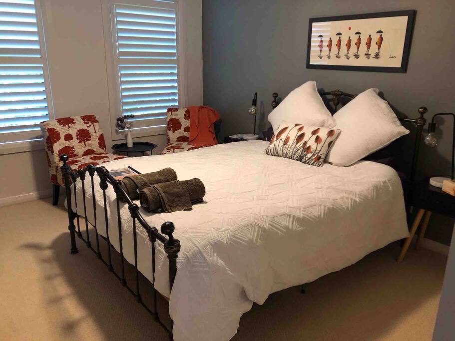 Bedroom one, views the canopy of the tree lined street