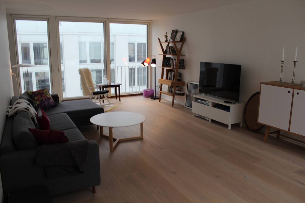 TV room on 2. floor with the couch where it also is possible to sleep