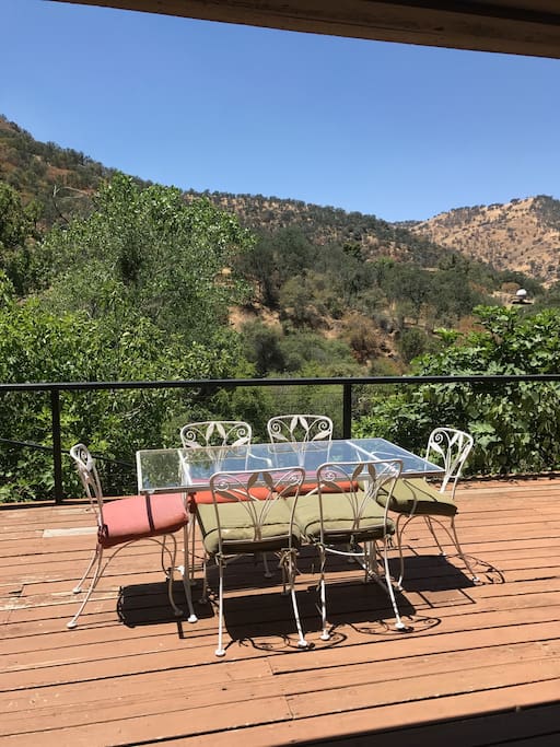 Back deck overlooking the river with lots of seating