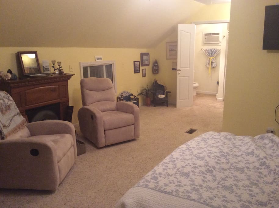 View of the bedroom standing at the foot of the bed.