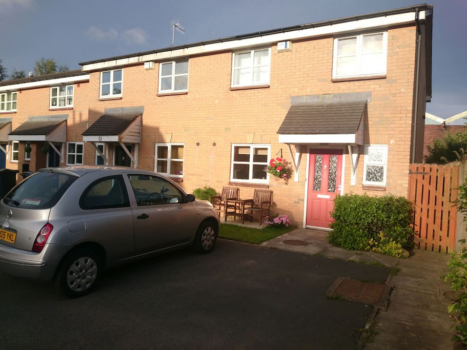 Front of house and parking space