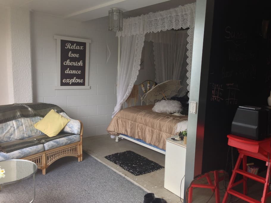 Lacy romantic 4 poster Queen bed and relaxing bedroom lounge to enjoy.