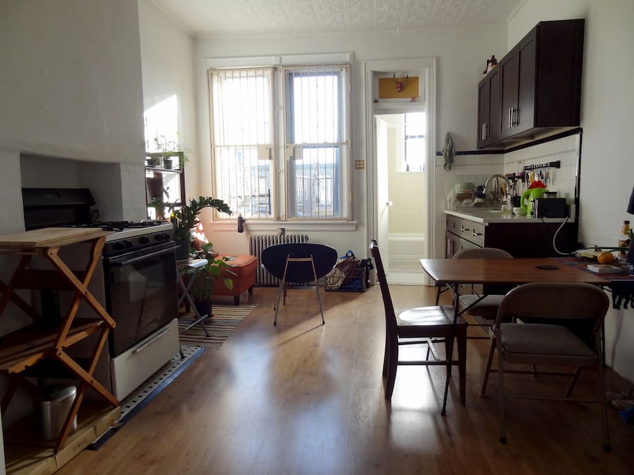 Kitchen, sitting corner and door to bathroom