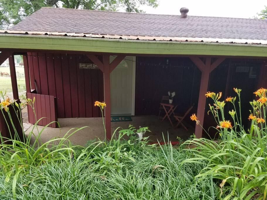 From the backyard looking in on your porch and entry door