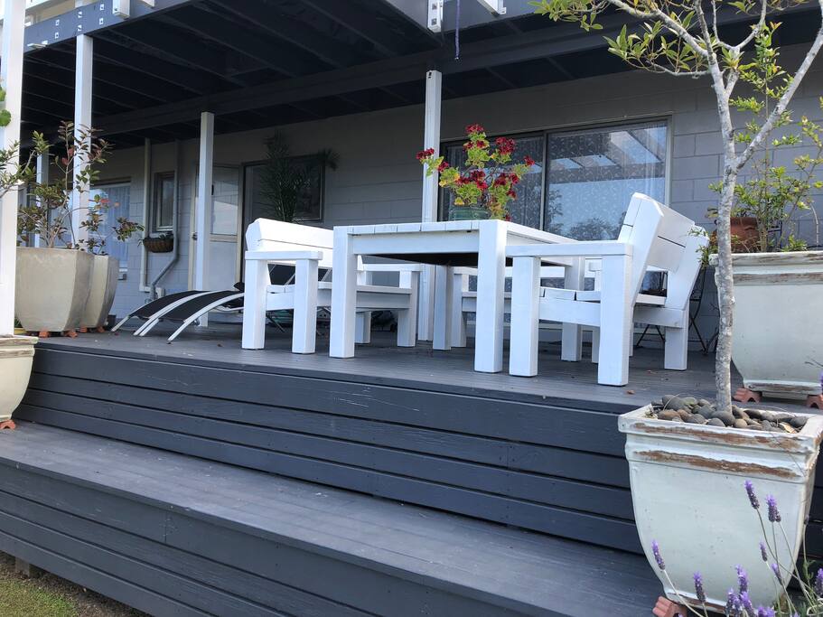 Enjoy your morning coffee and evening wine on the deck outside your room