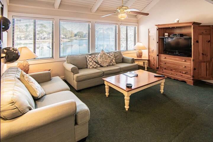 Spacious living room with TV and plenty of seating!
