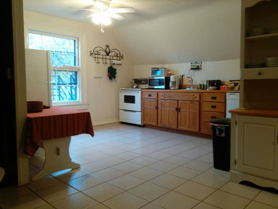 Large kitchen: plenty of pots pans and dishes. Full size fridge, stove and dishwasher.