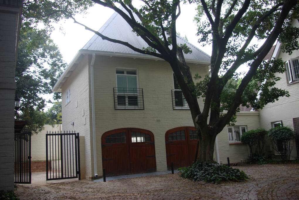 The loft apartment over the garage with entrance to parking on the left