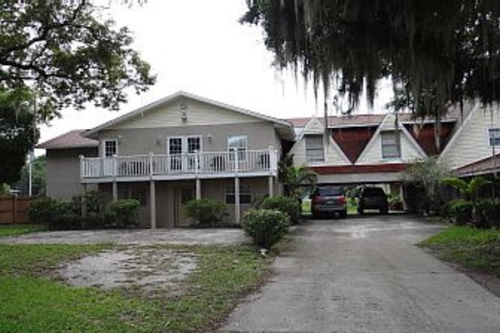 Front of house, shared covered parking w a house next door