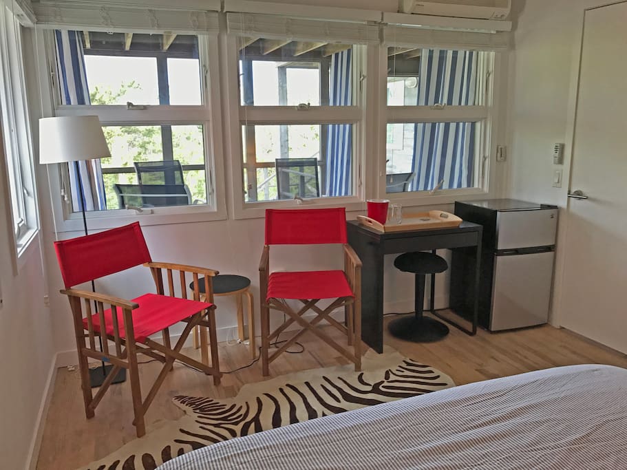 Amenities include a mini fridge, Beach towels, and beach chairs.