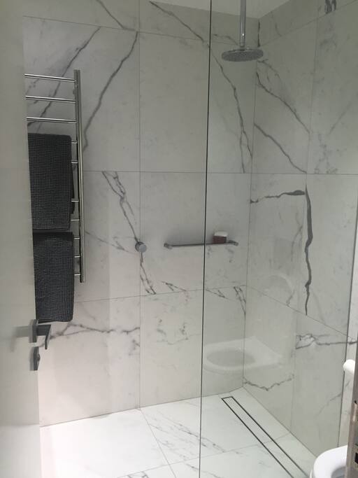 ensuite bathroom with rain shower head /heated towel rail