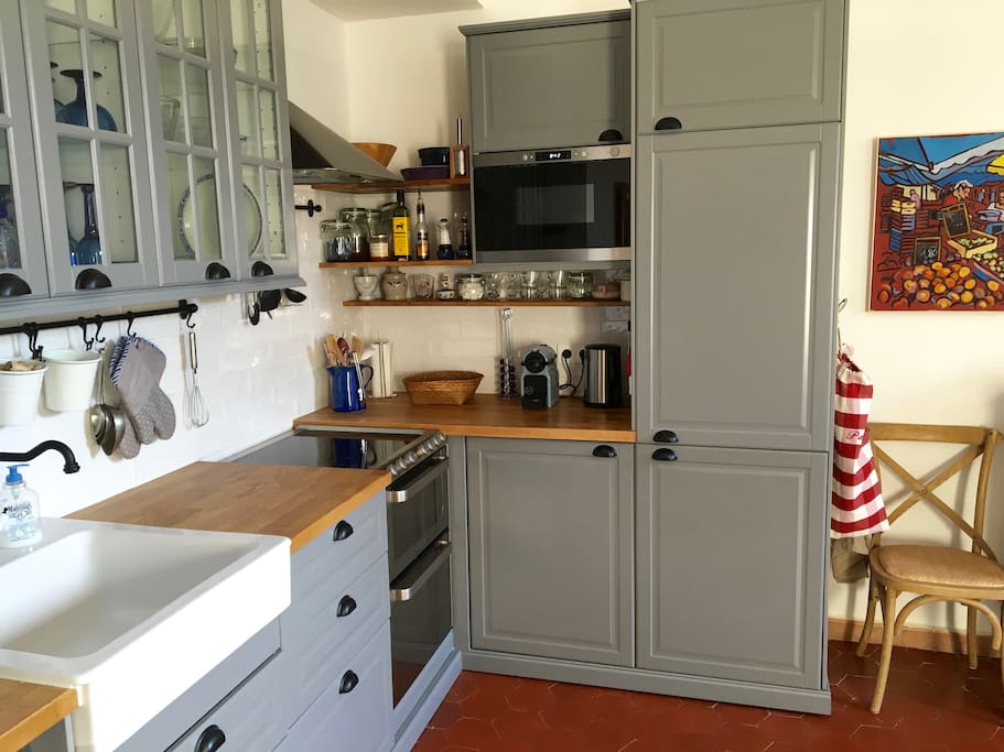 The kitchen has been completely re-done and features a harvest sink, fridge, freezer, 4 burner induction stove, convection oven, microwave, Nespresso machine and a dishwasher.