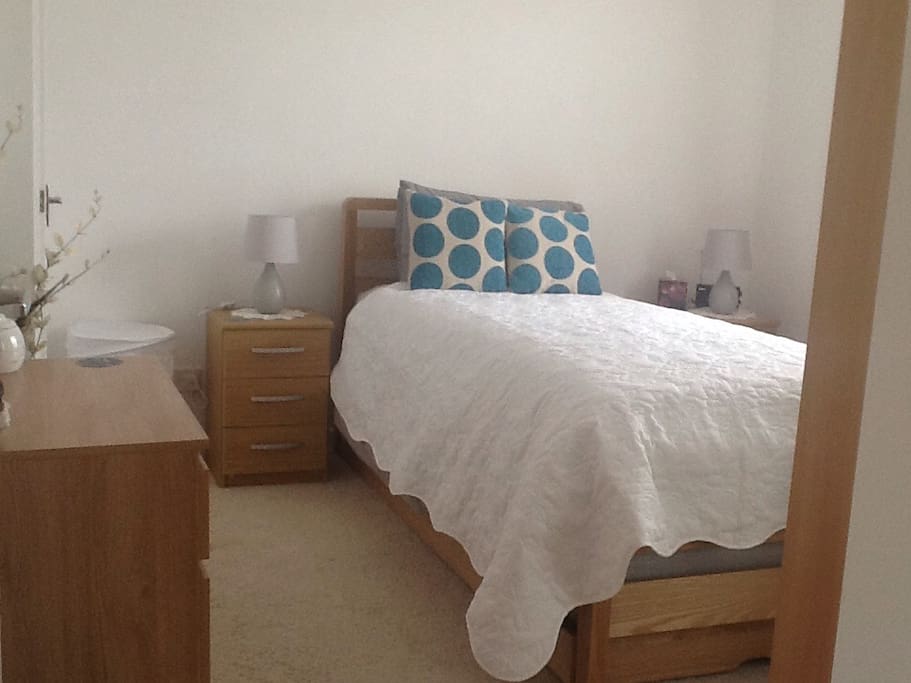 Freshly decorated bedroom. Plenty of clothes storage. Nice view over green area outside.