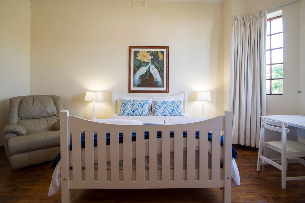 Large bedroom with queen sized bed and gorgeous mountain view. It also has plenty of built in cupboards.