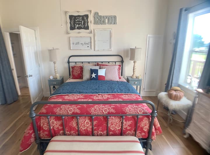 Large master bedroom with a queen size bed. 