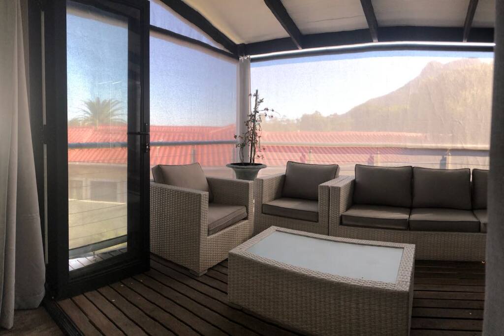 Sun-downers in the cool while having views of the mountains to the right and the salt lake to the left