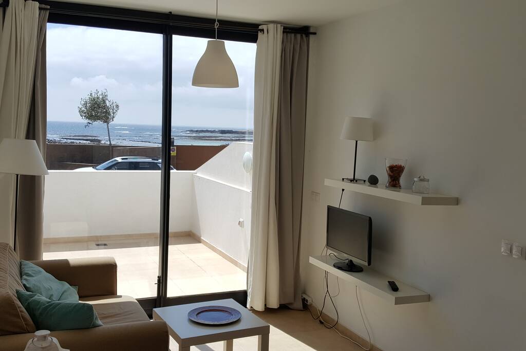 SOFA AND TV WITH SEAVIEW