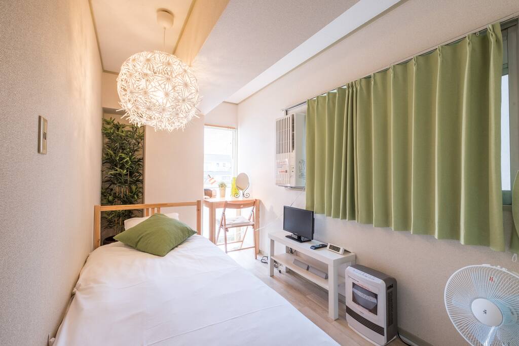 The second bed room: 1 single bed, air conditioner, fan, heater, TV, desk & chair