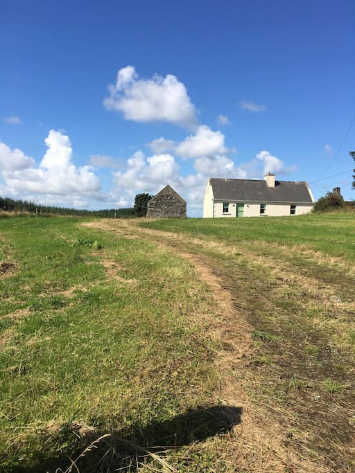 The cottage is set back from the road.