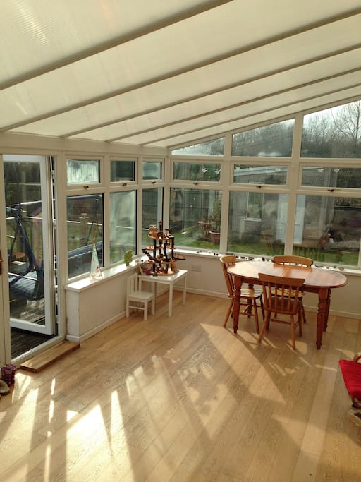 Conservatory opening out onto south facing decking and garden
