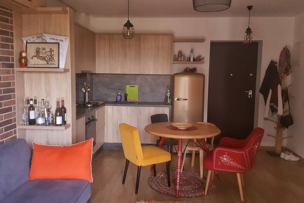 The living room and the kitchen seen from the balcony.