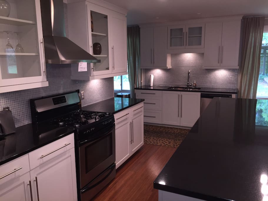 great open kitchen for entertaining - fully equipped just like home (pots, pans, coffee maker, blender, microwave ..........