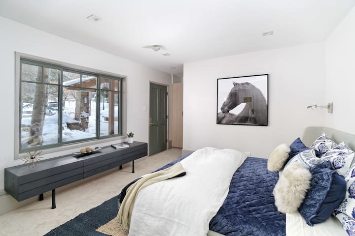 Spacious and modern second bedroom featuring king bed, private bathroom, and private entrance