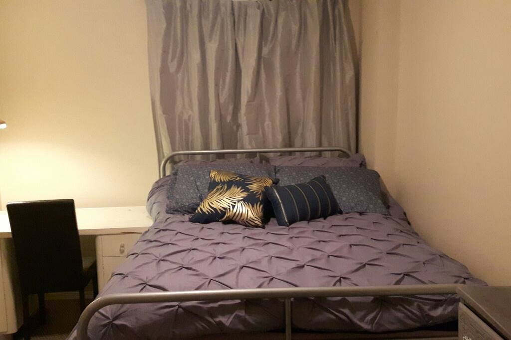 bedroom with dresser and desk
