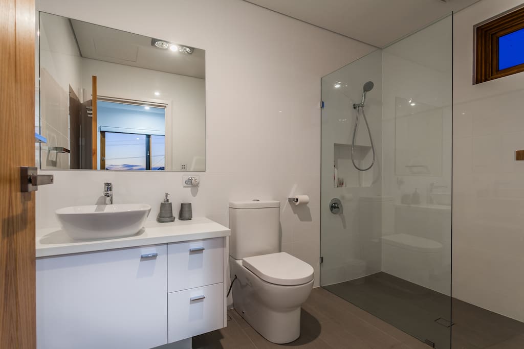 En-suite ( Attached bath & toilet) with complimentary towels, shower gel, shampoo & conditioner