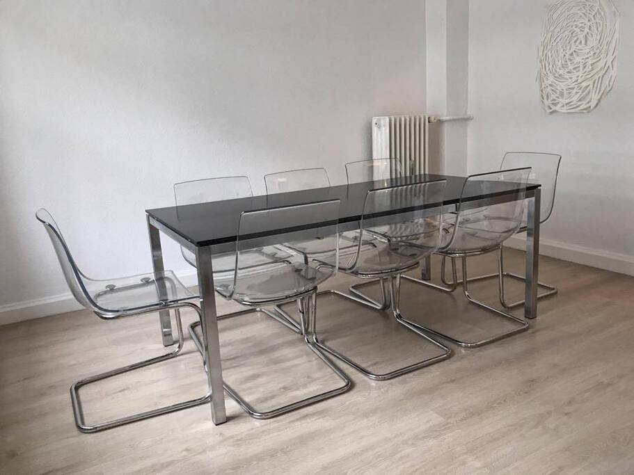 Dining area in livingroom, with funky comfy chairs.