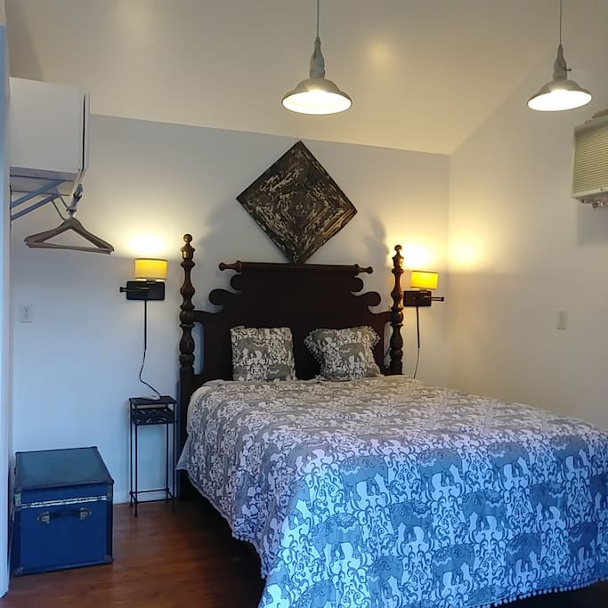 Comfy Queen Size Bed facing French doors and pool