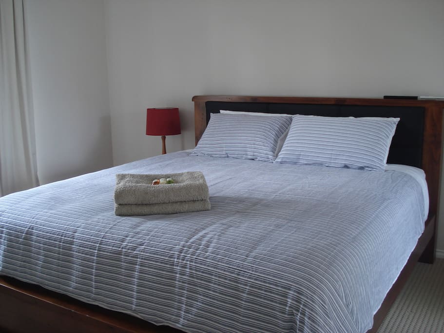 The king size room has its own space with couch and TV.