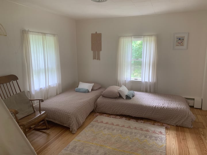 Kids room with low beds and toys.