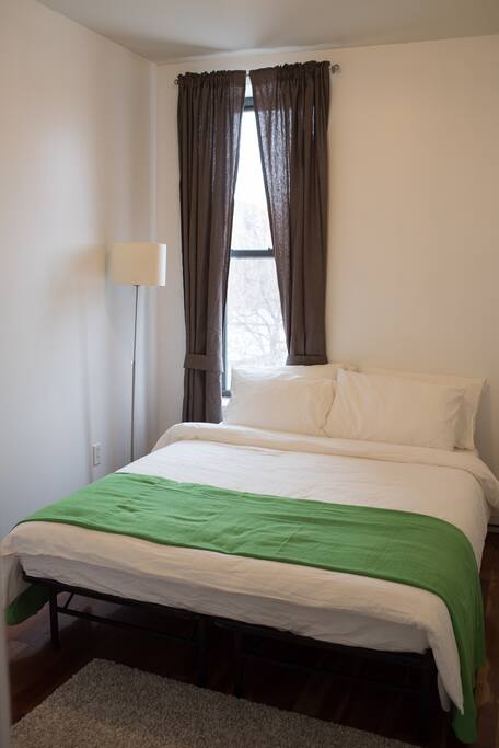 Bedroom with Queen Sized Bed and Closet and Mirror