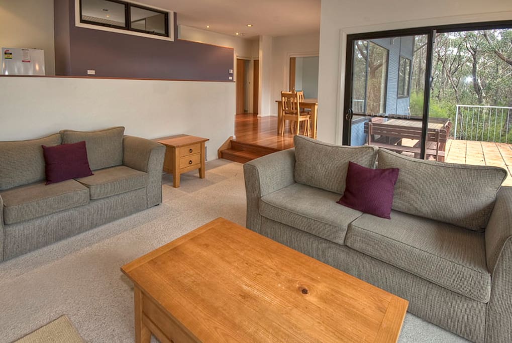 Sunken lounge area through to dining and rear deck