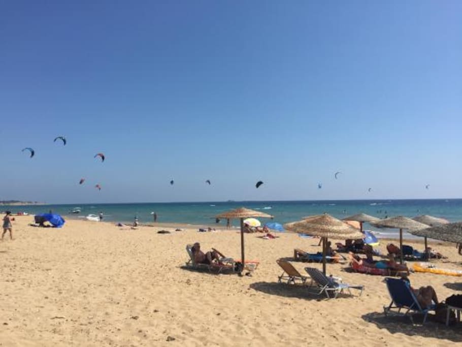 Halikounas beach has water sports and beach bars - kite surfing is popular when the wind is right