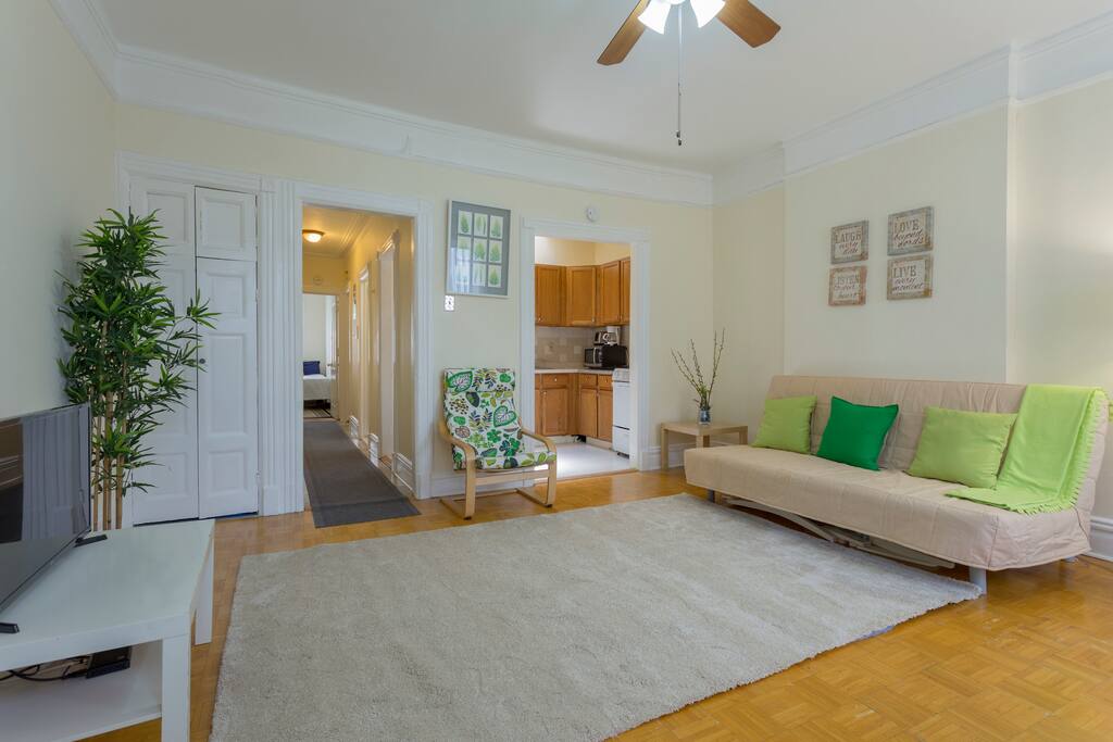 view of hallway leading to bedroom #1, kitchen and living/eating rooms.