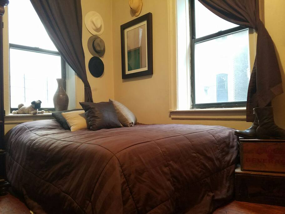 Cozy and comfortable corner bedroom receives most light in the apt (or the least, thanks to heavy curtains)