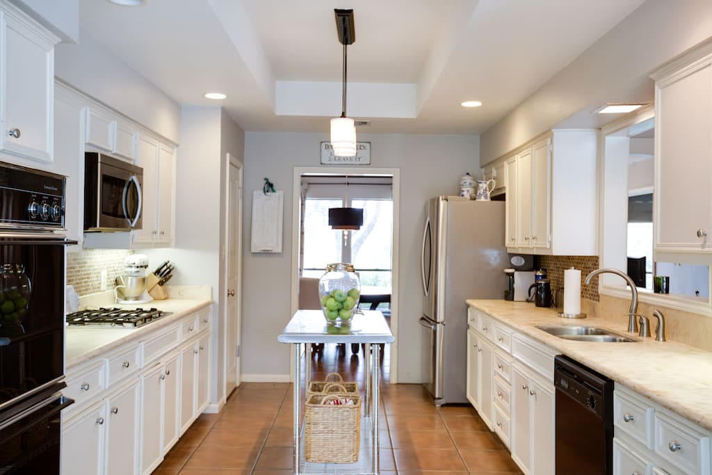 The kitchen connects to the dining room, the living room, and a reading nook that leads to the backyard. It really is the heart of the home.